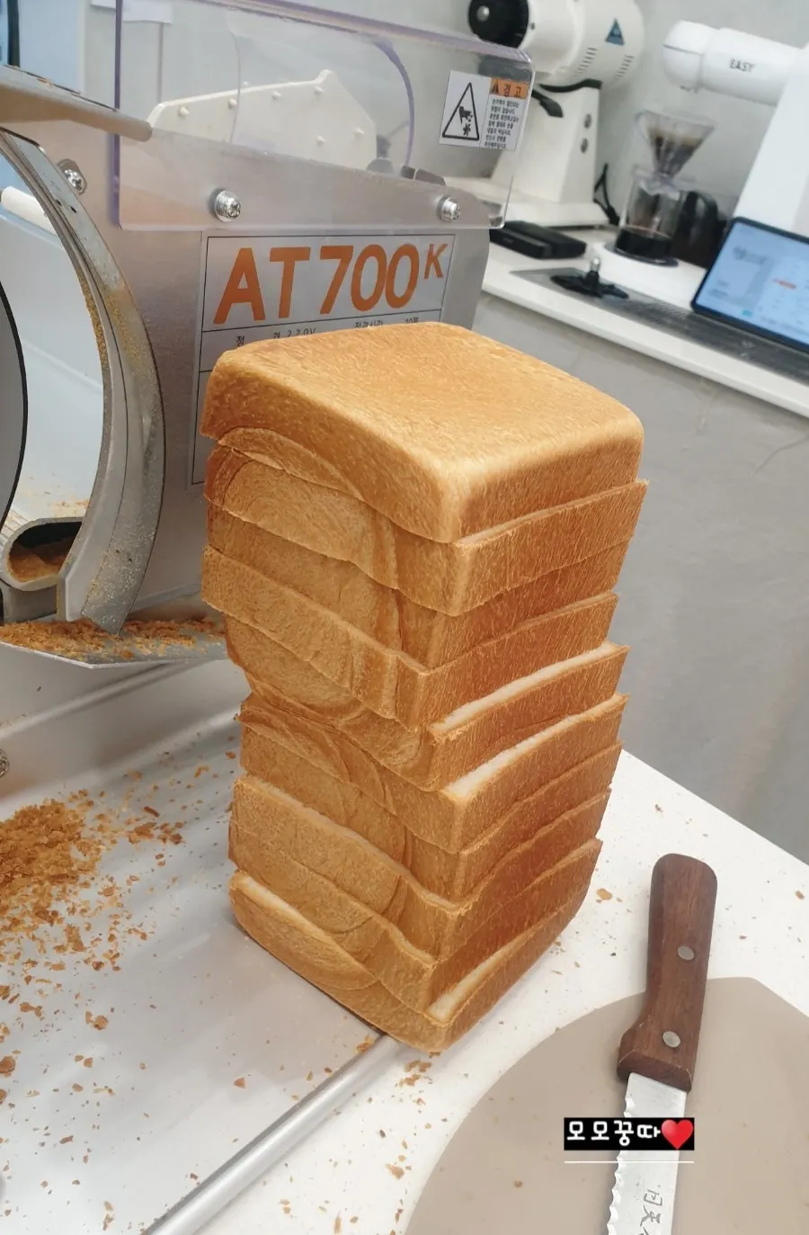 Golden Beurre milk bread being cut to 2cm thickness