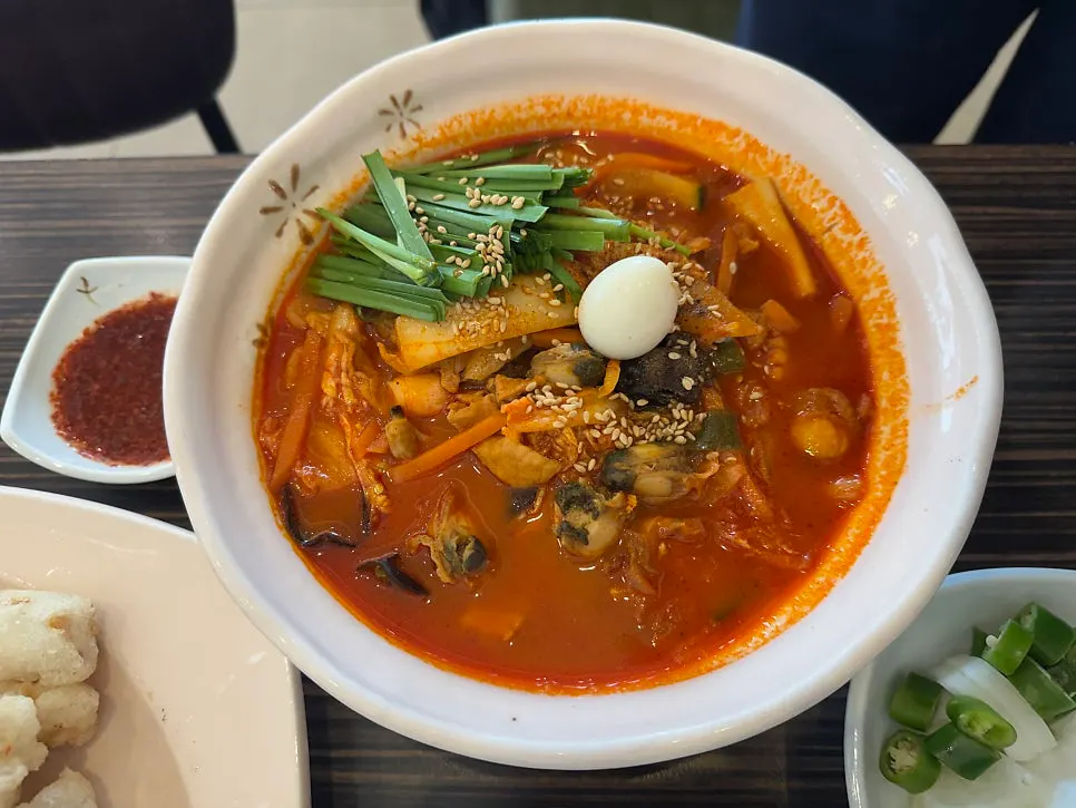 Close-up of the Jijon Jjamppong broth and ingredients