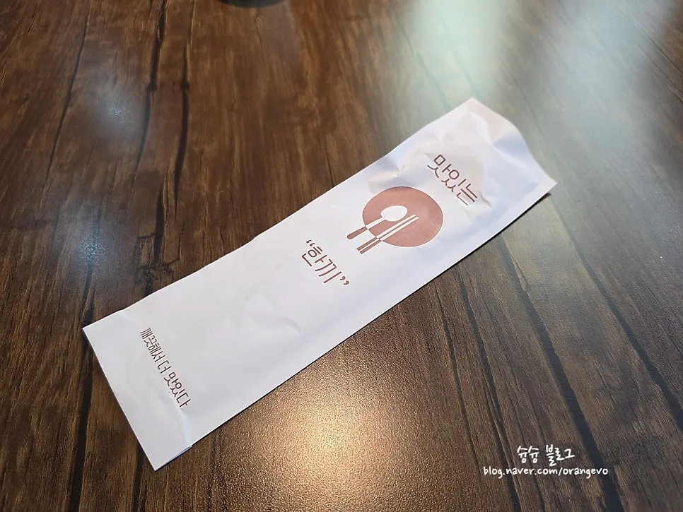 Neatly wrapped spoons and chopsticks on a spacious table