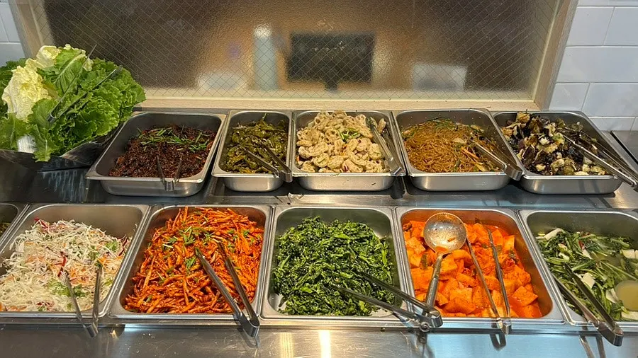 Self-serve bar loaded with side dishes