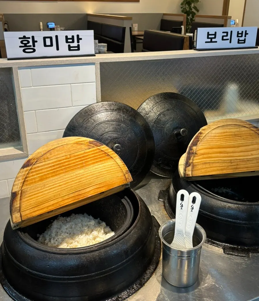 Yellow rice and barley rice in a cauldron