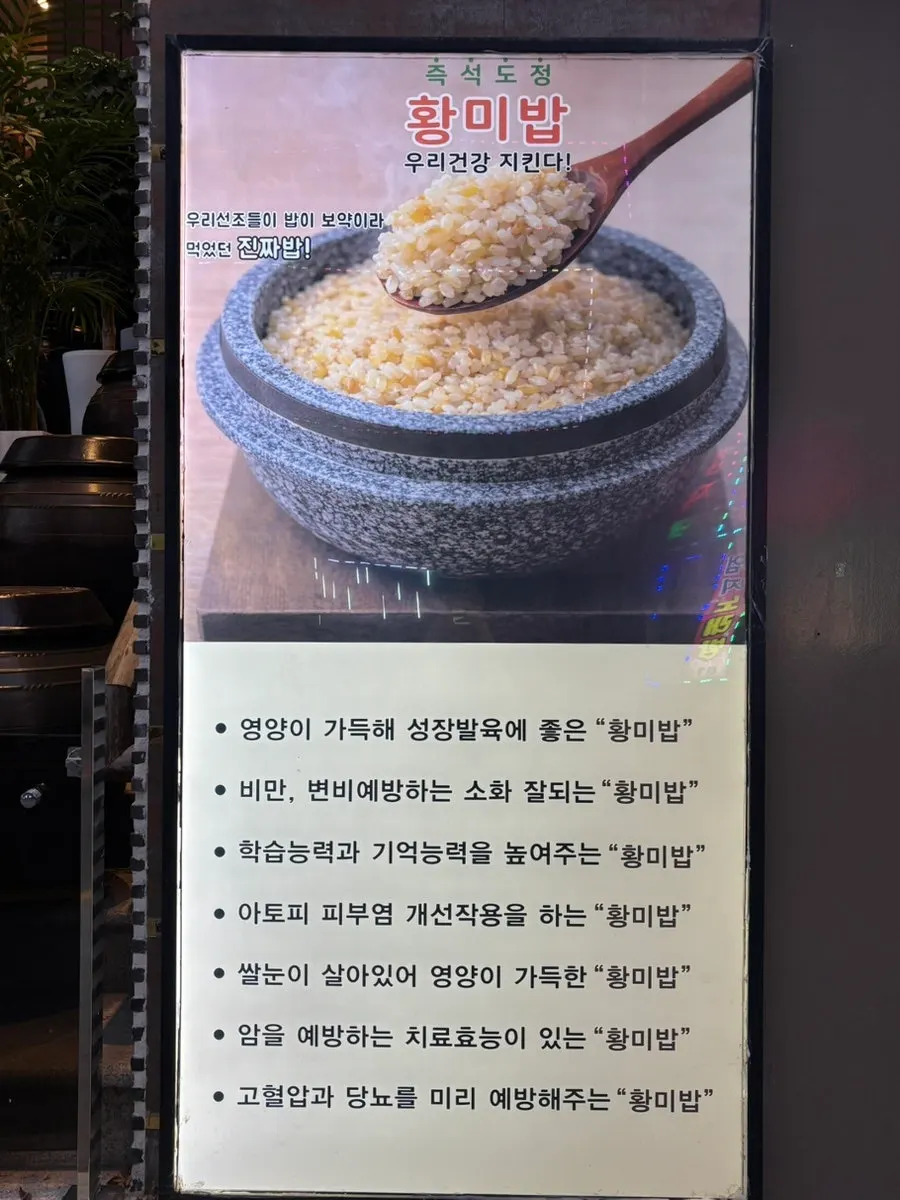 Yellow rice grains falling from the milling machine