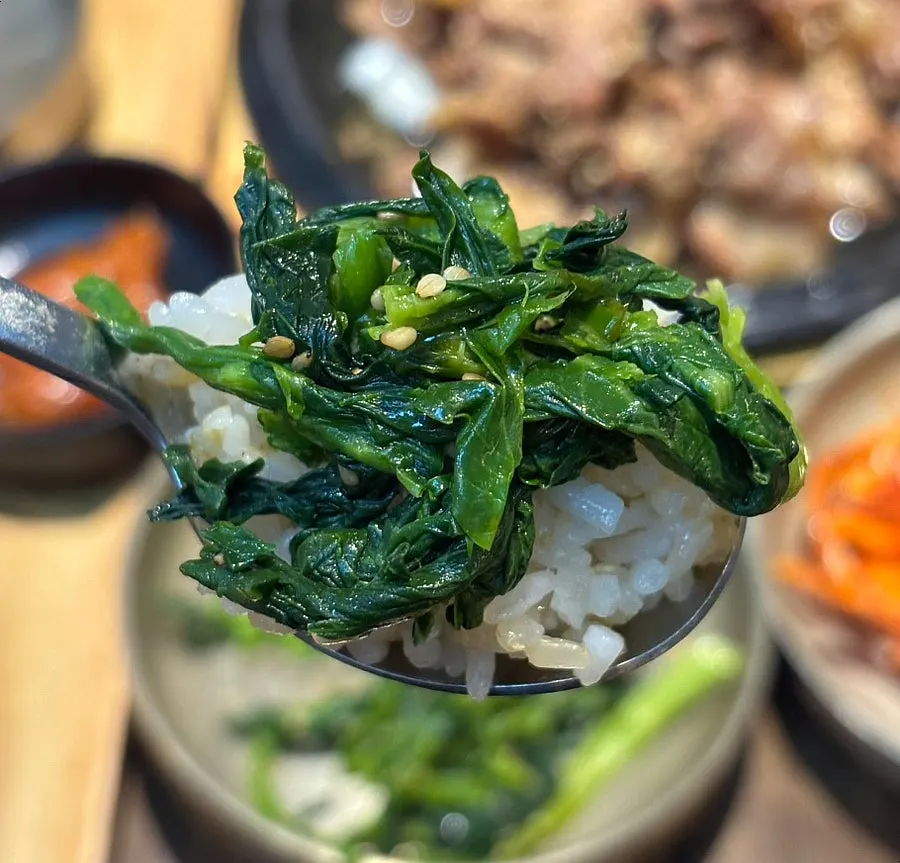 Full spread of 12 side dishes on the table