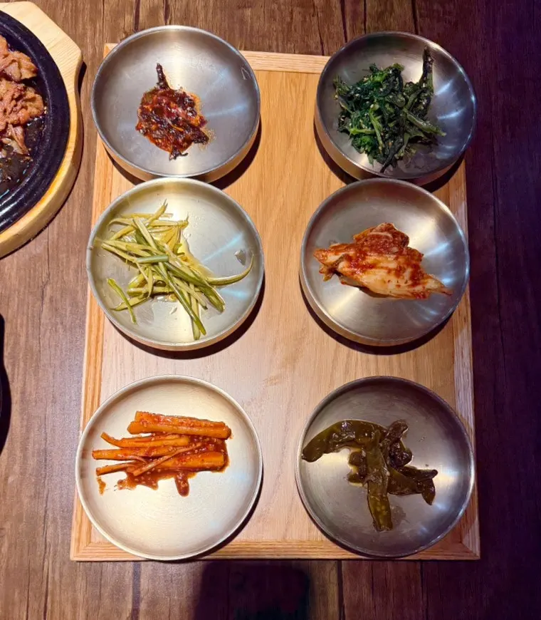 Close-up of namul side dishes in small bowls