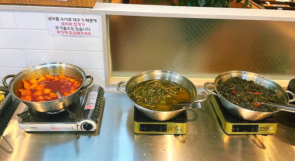 Neatly arranged namul side dishes at the self-bar