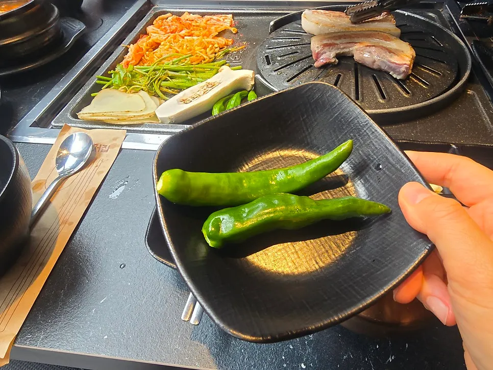 Fully cooked meat moved to the lower grill