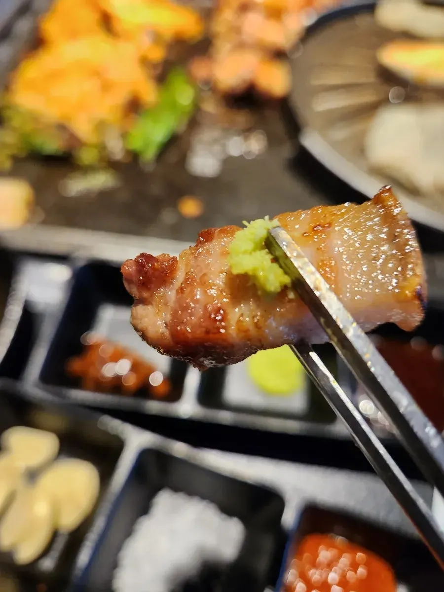 Thick pork cooking on the grill