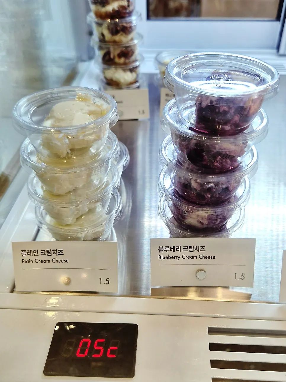Display sign listing prices for each type of milk bread
