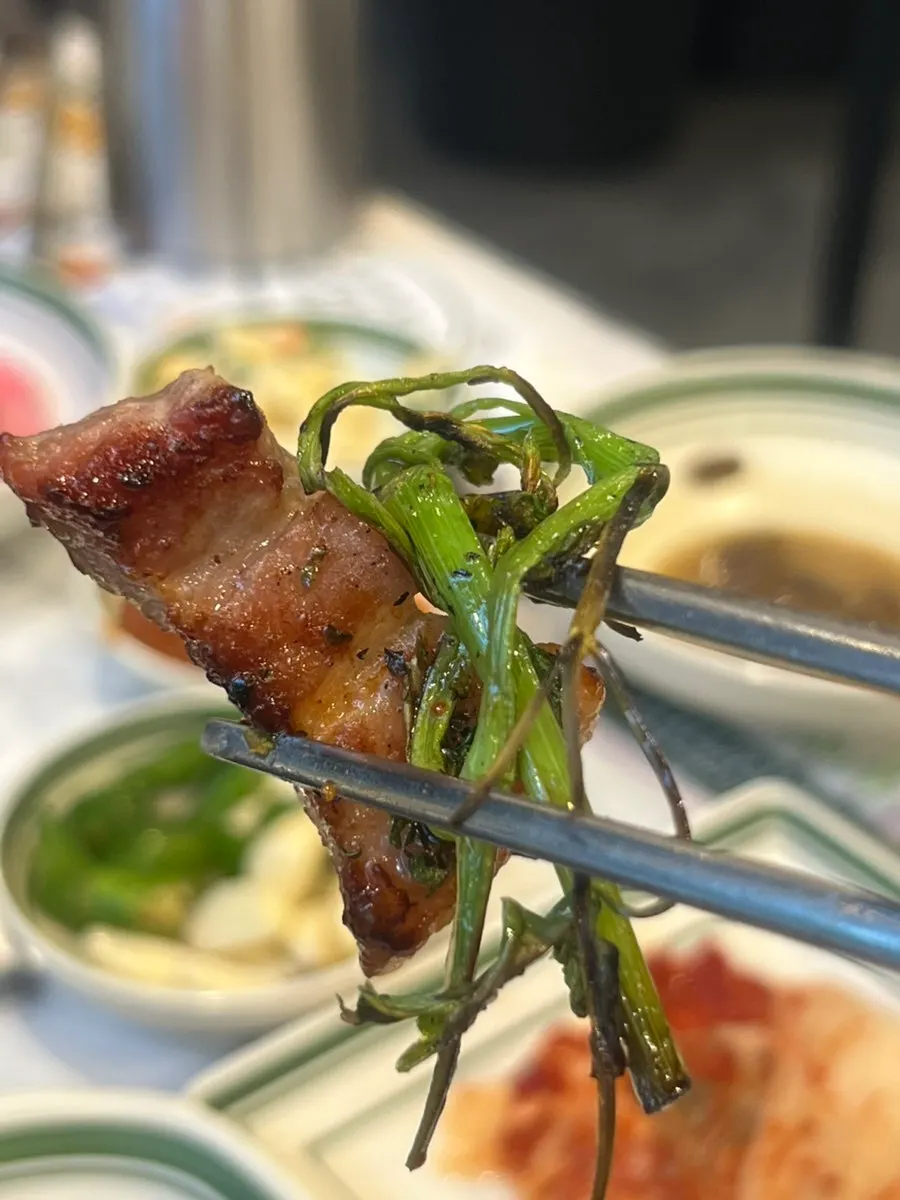 Close-up of a grilled slice of pork belly
