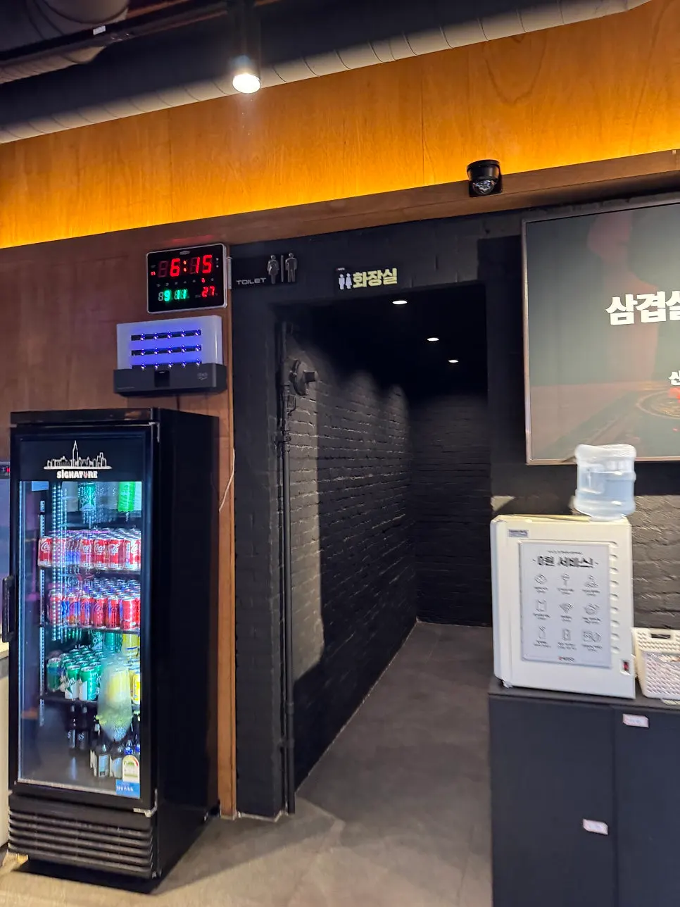 Amenity stand with aprons, hair ties, and other supplies
