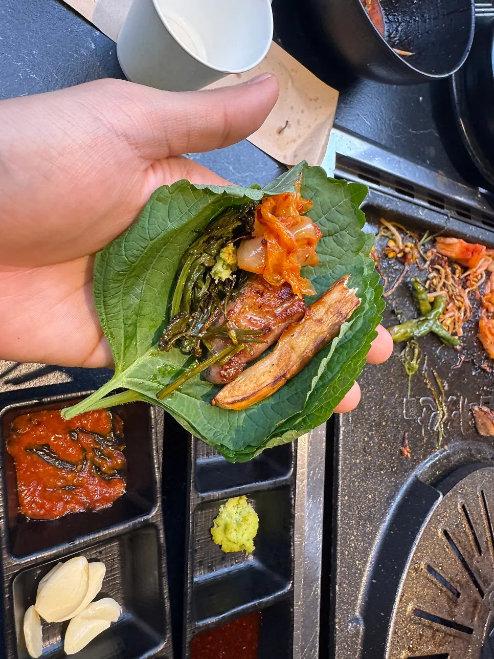 Grilled meat kept warm on the lower warming pan
