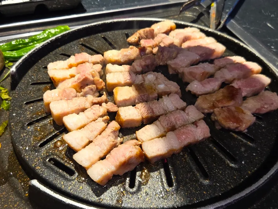 Cham Dwaejitgan pork belly grilled by staff