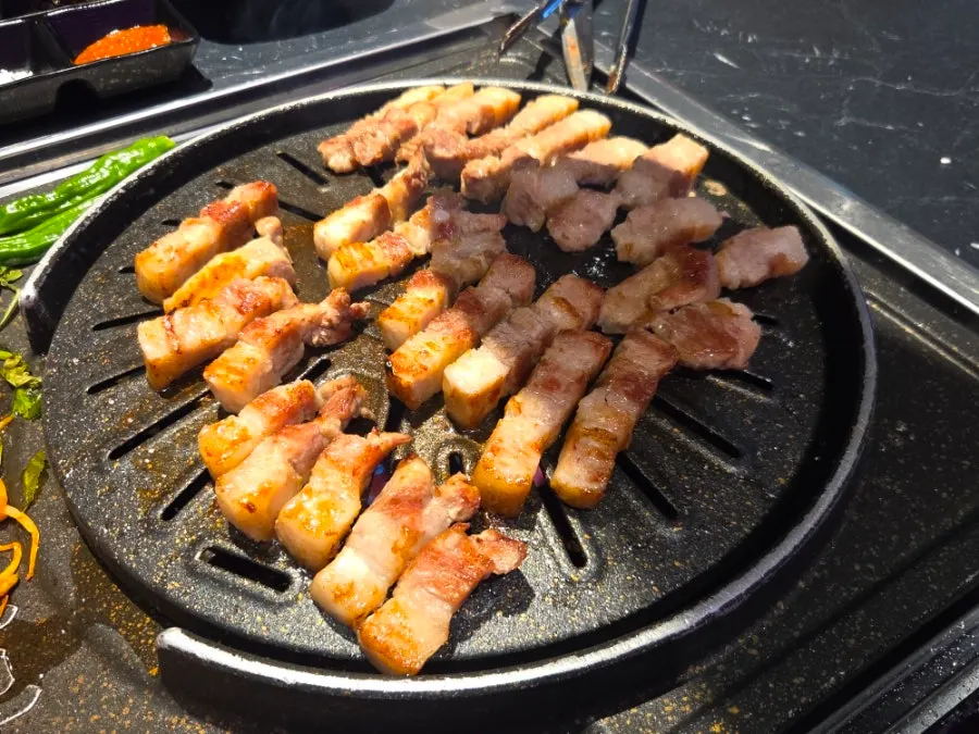 Cham Dwaejitgan pork belly grilled by staff