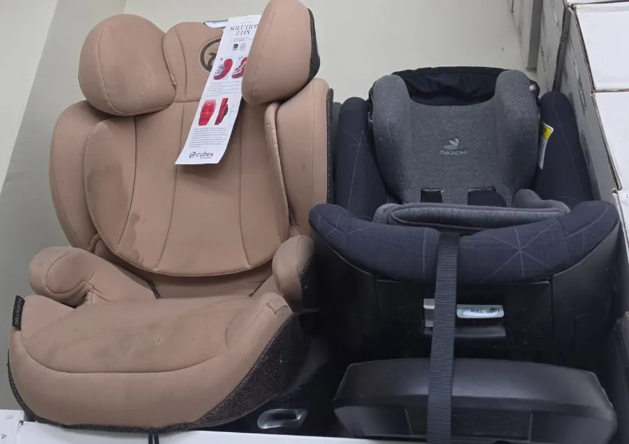Car seats and strollers finished and wrapped in plastic packaging