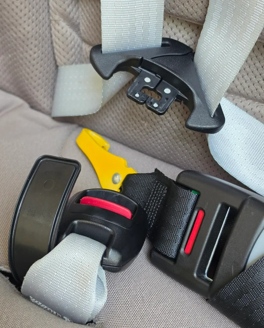 Damaged spot on the car seat repaired discreetly with adhesive