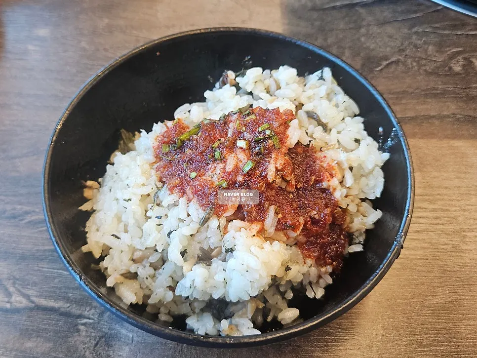 A second bowl of gondre rice mixed with extra seasoning sauce