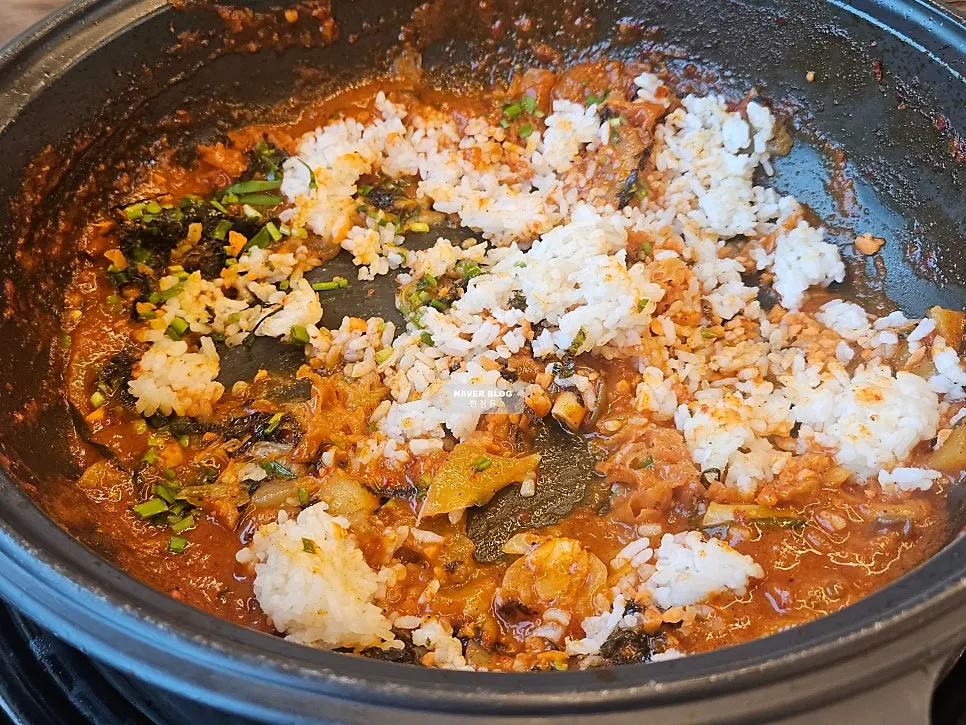 Fried rice being stir-fried in the pot