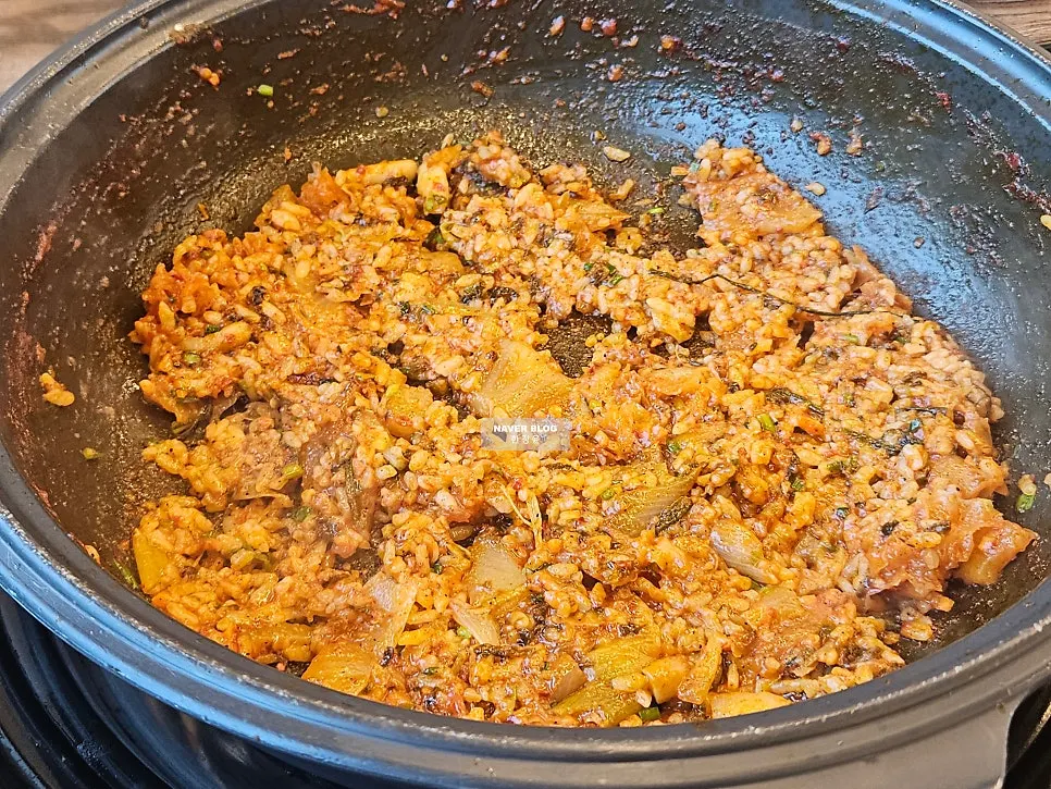 Fried rice pressed flat while cooking