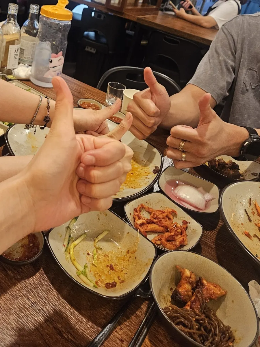 A wrapped bite combining makguksu and jokbal