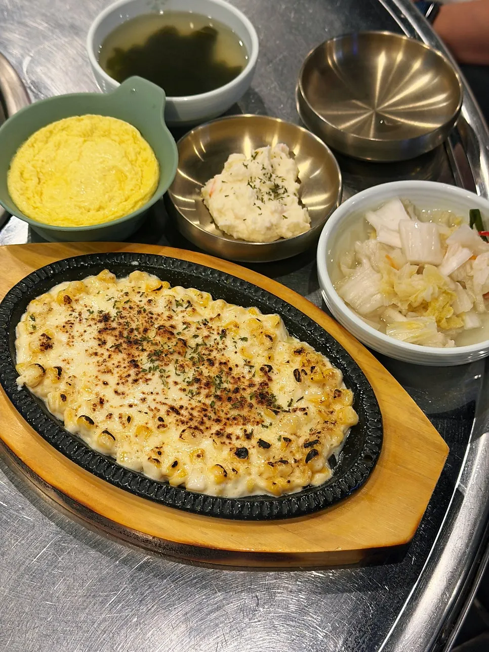 Banchan spread served alongside the hot plate seafood monkfish stew