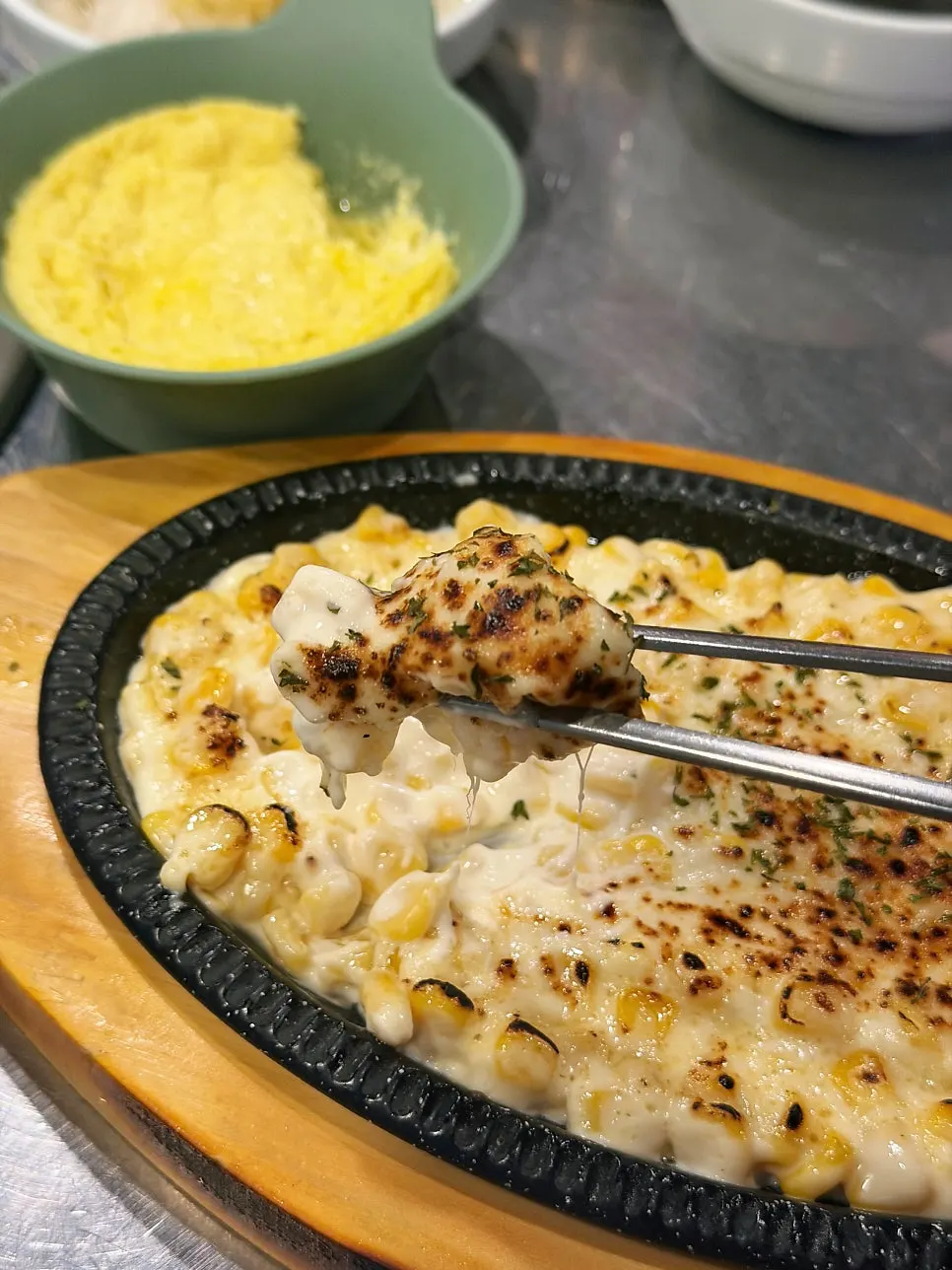 Stretchy melted cheese on the corn cheese