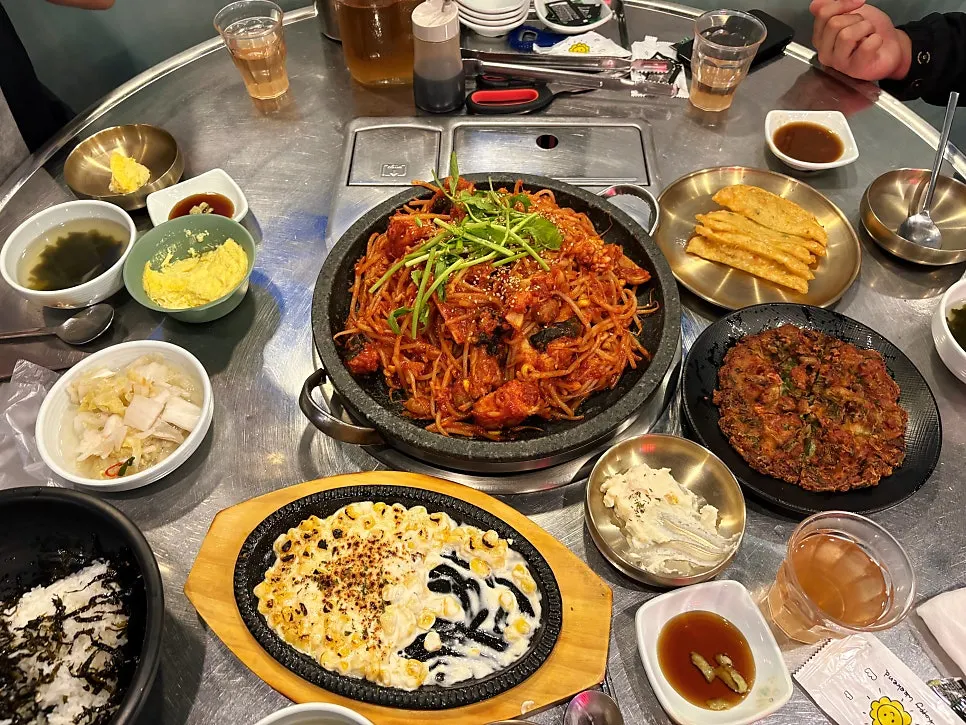 Full table spread of the hot plate seafood monkfish stew set