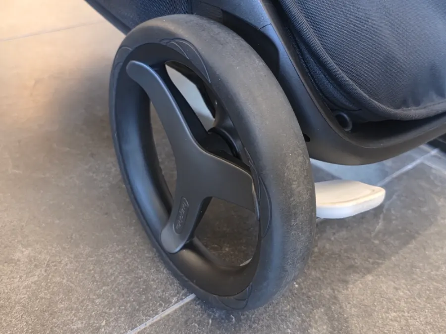 The taped rear wheel of the stroller