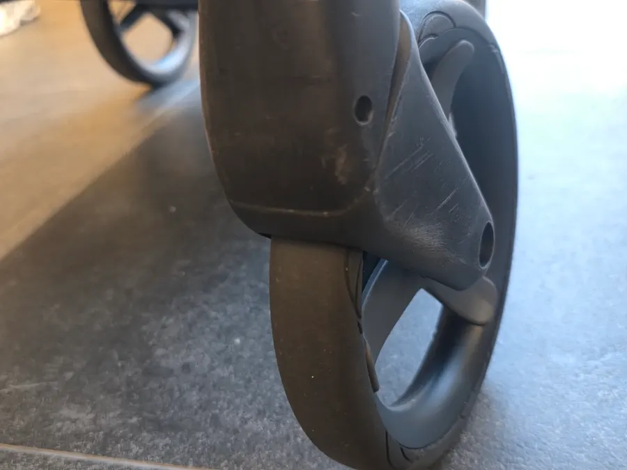 The front wheel area of the stroller after washing