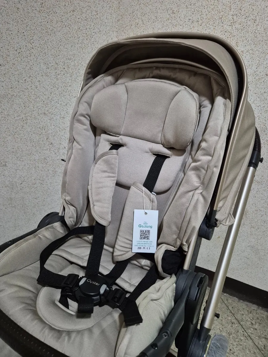 White protective cover placed over a stroller wheel