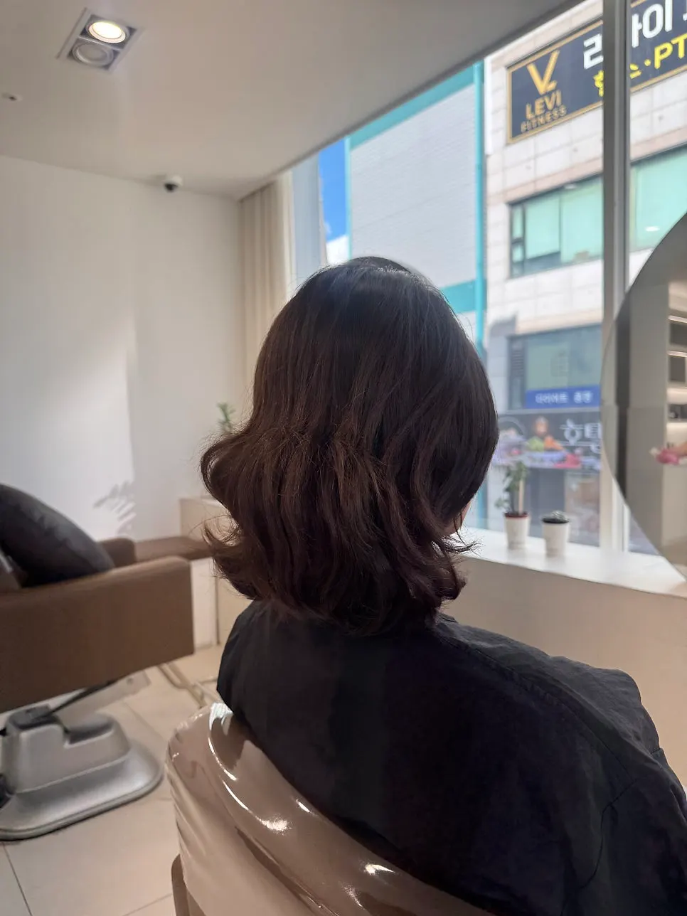 Hair let down after being tied up, before the treatment