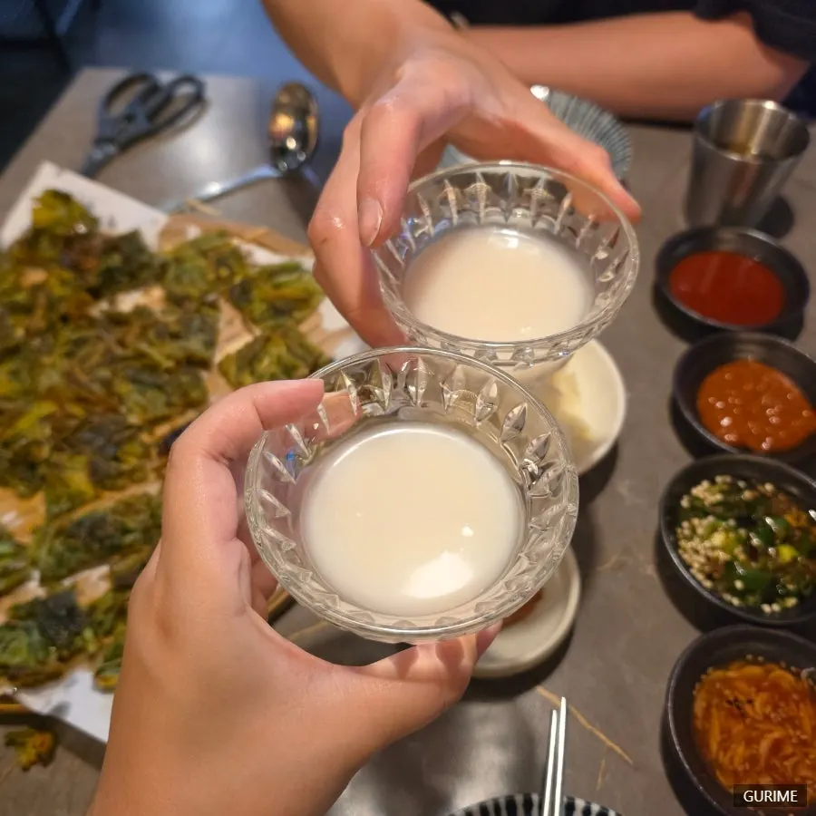 Buchigom makgeolli poured into a glass