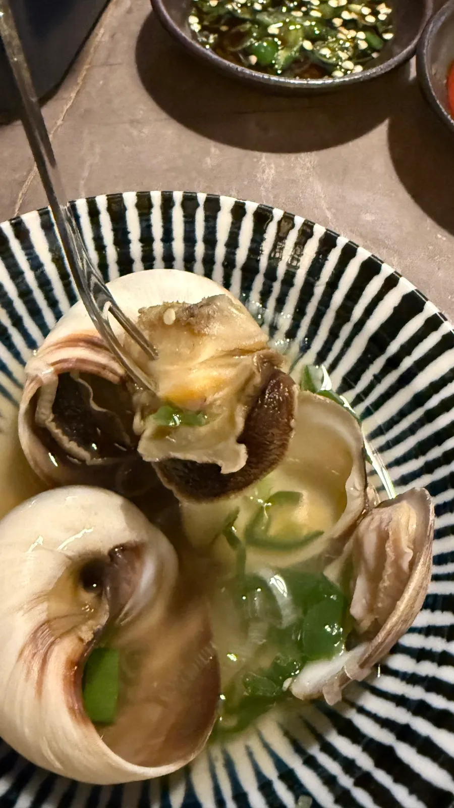 Whole whelk dipped in chojang sauce