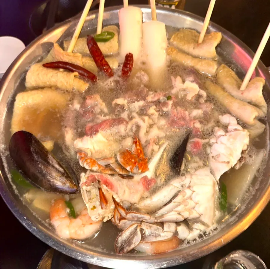 A bowl ladled with broth from the beef brisket seafood odeng-tang