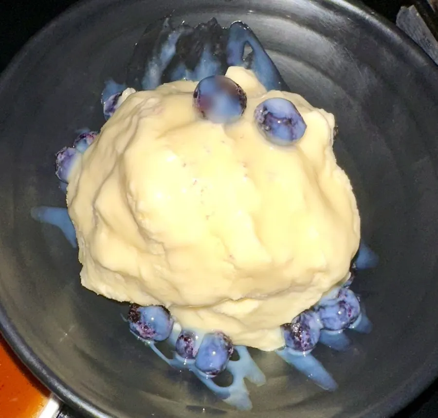 Ice cream dessert topped with blueberries