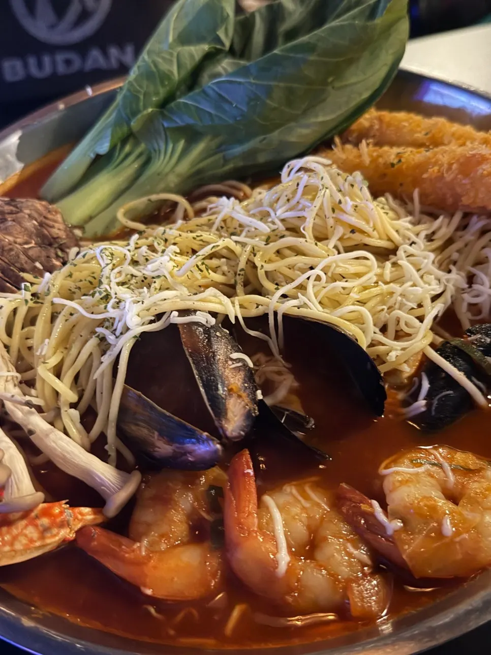 A generous serving of jjapaguri and green onion kimchi