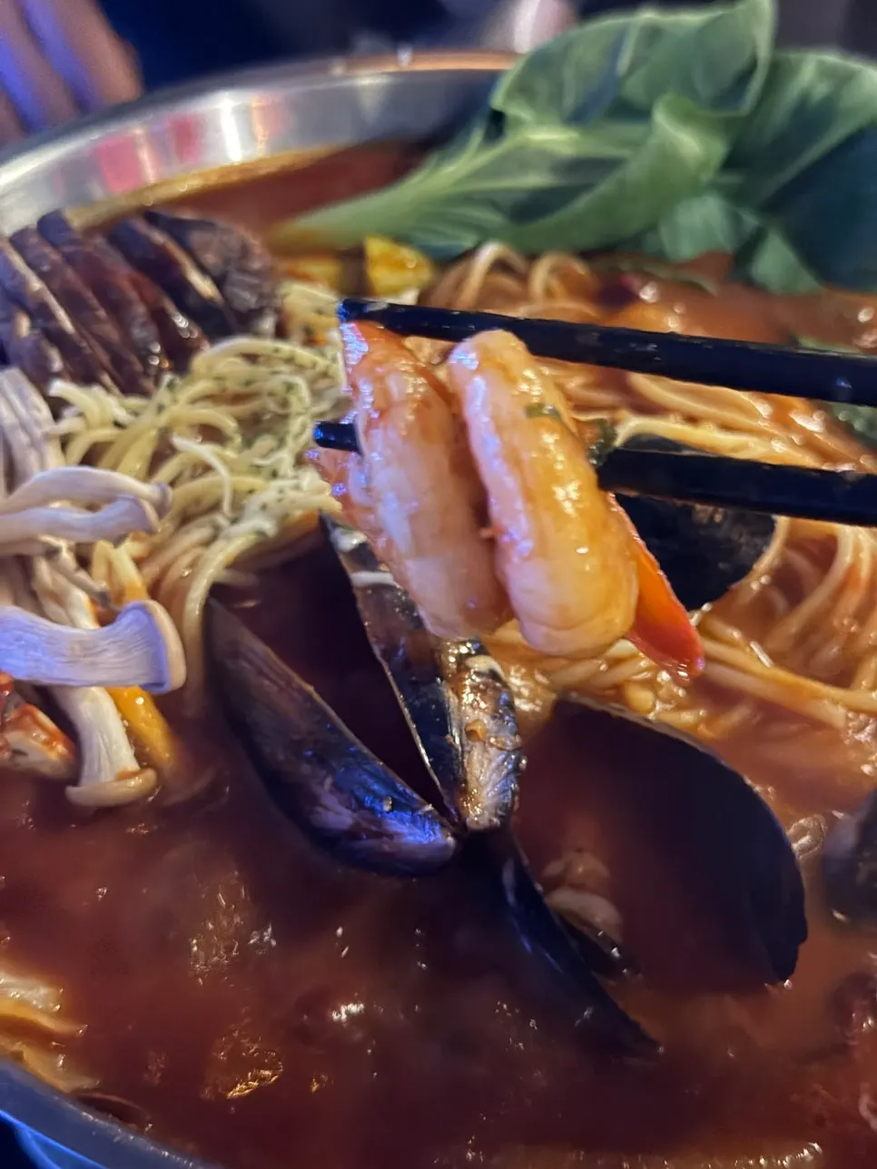 Hangover seafood pasta stew topped with fried shrimp