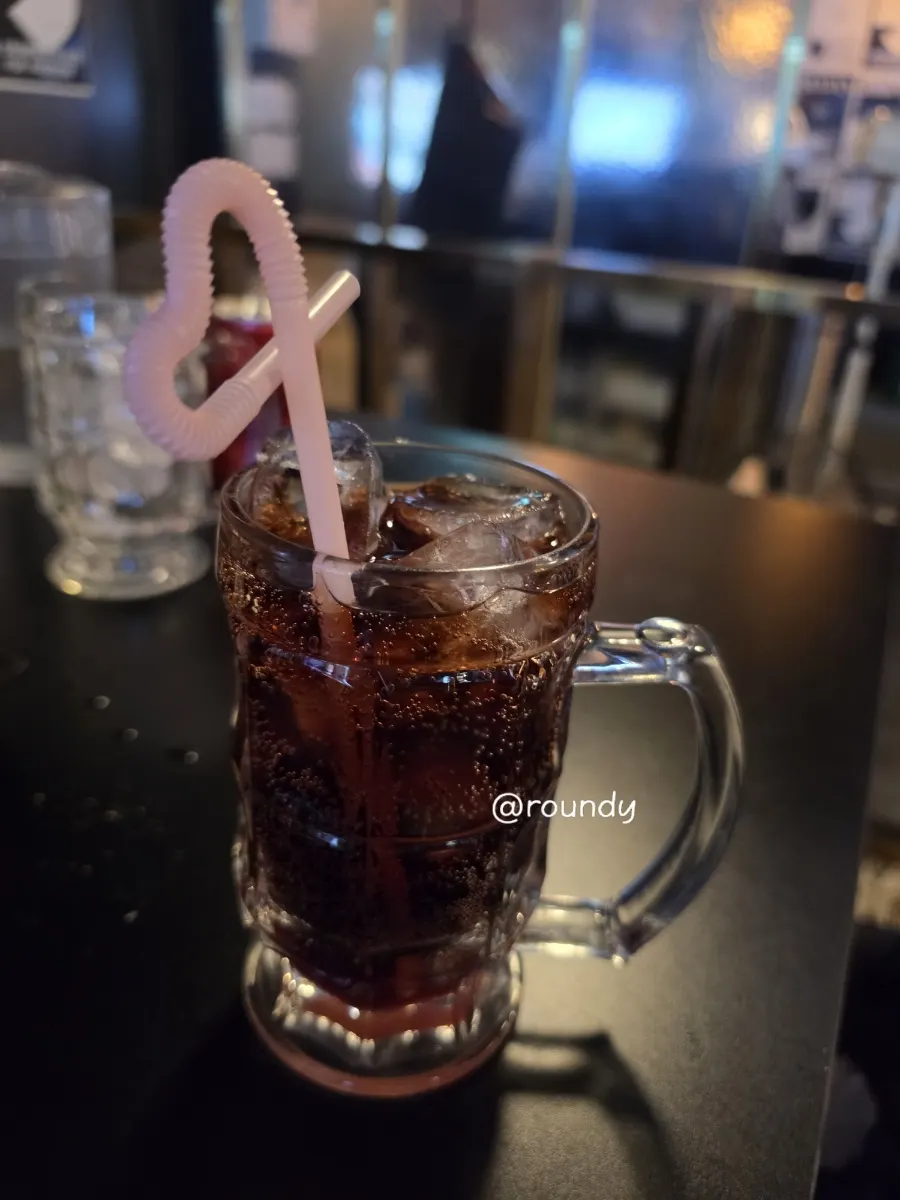 A glass of cherry cola ordered instead of alcohol
