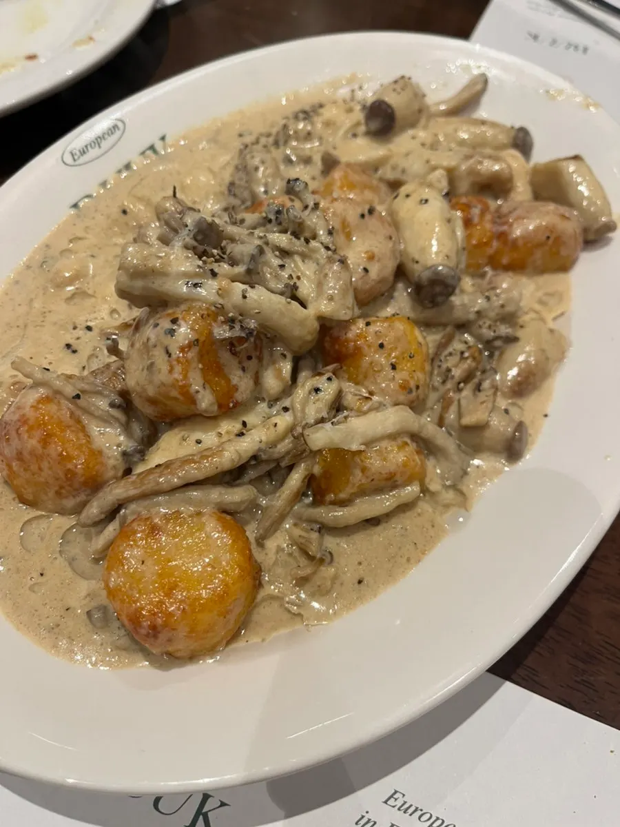 Bueokgan's truffle mushroom cream gnocchi piled with mushrooms