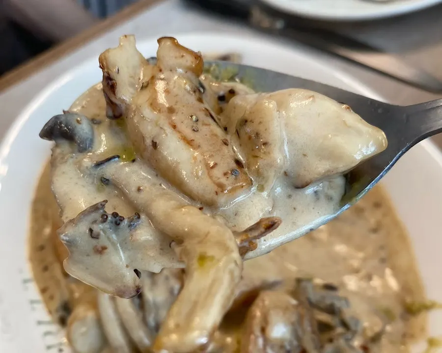 Close-up of the rich sauce on cream gnocchi