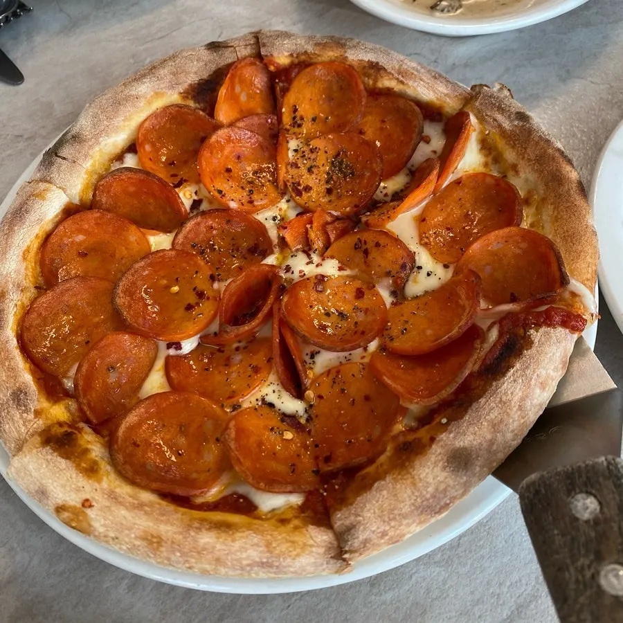 A whole pepperoni pizza at Bueokgan Sangmu Branch