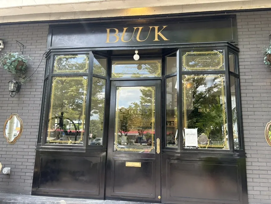 The black-and-gray-toned exterior of Bueokgan Sangmu Branch