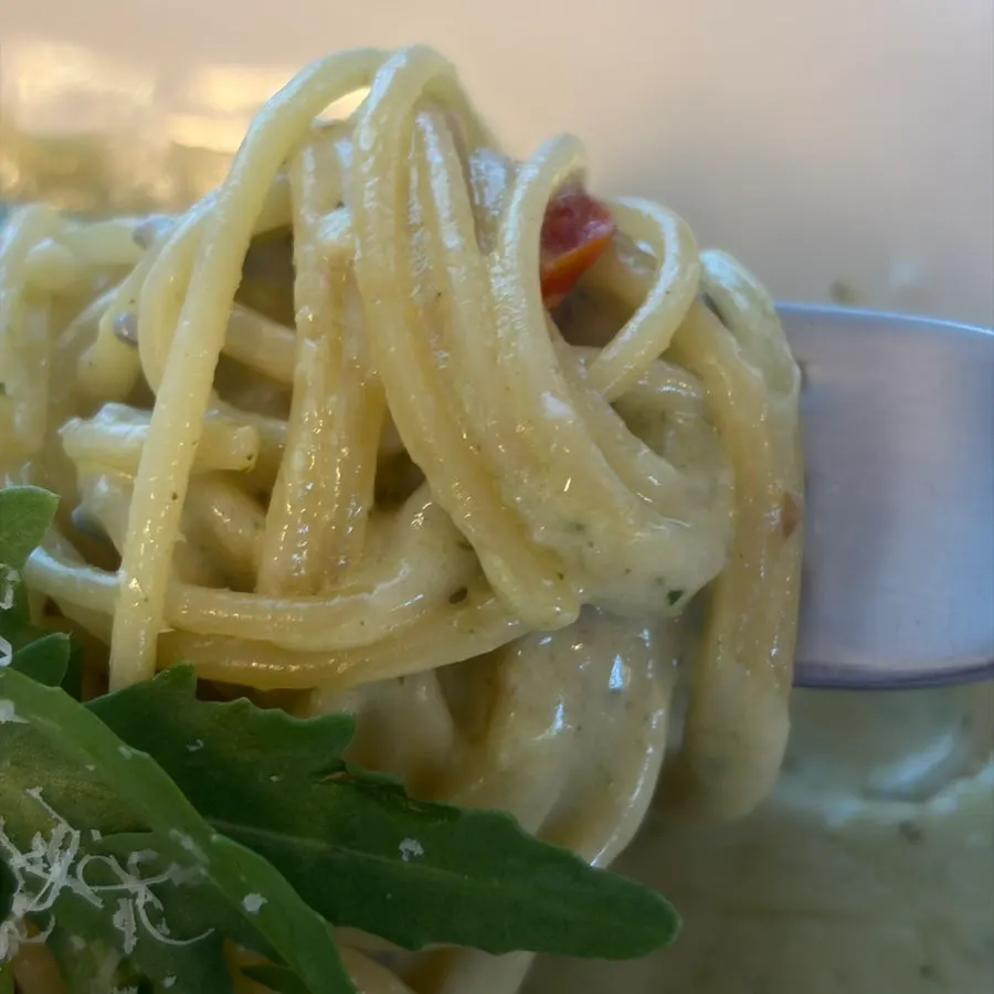 Plate of basil pesto cream pasta