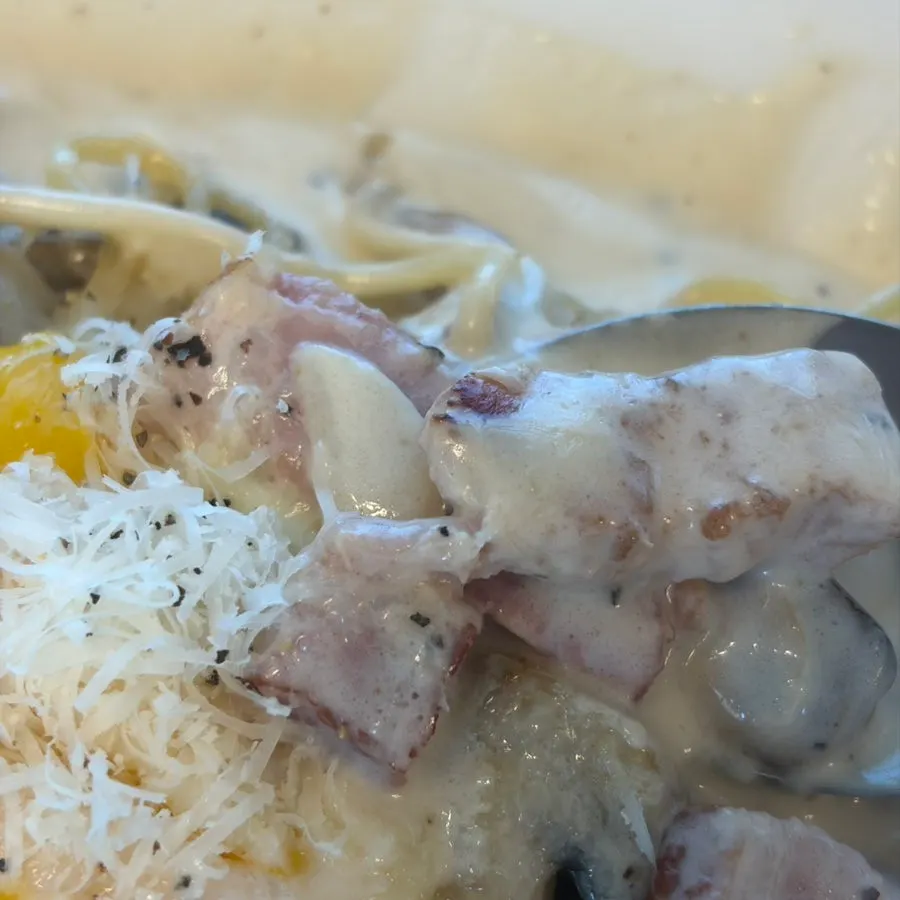 Basil cream pasta served with arugula