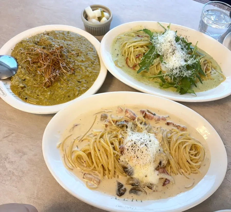 Dining table with cream pasta and risotto together