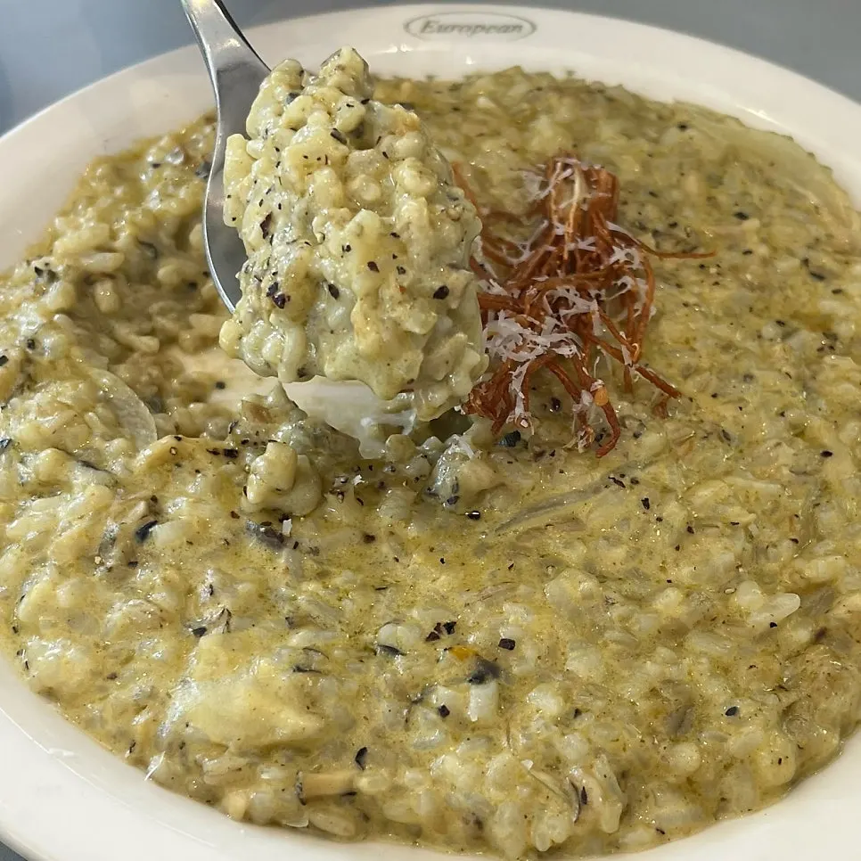 Abalone cream risotto topped with fried enoki mushroom