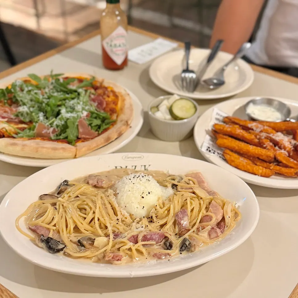 Sweet potato fries, pasta, and pizza served together at once