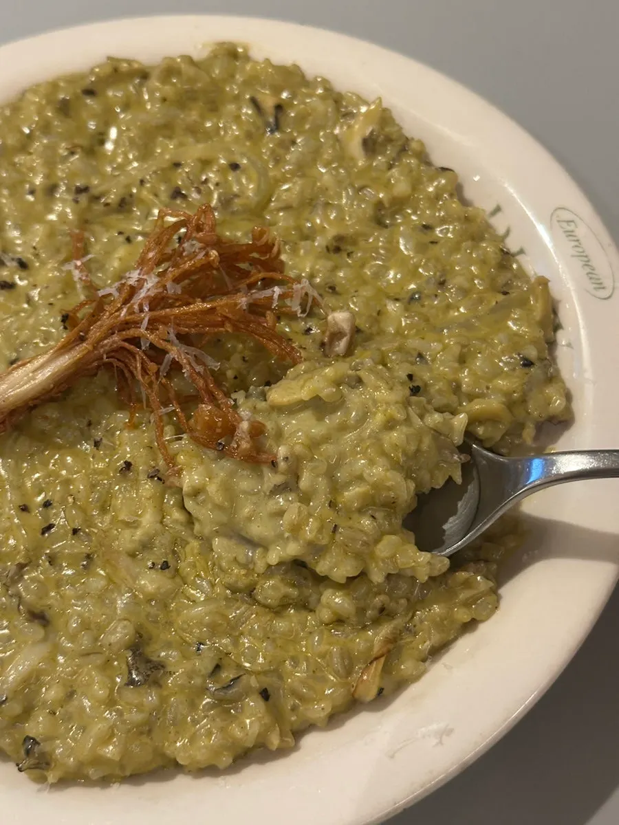 Abalone cream risotto topped with fried enoki mushrooms