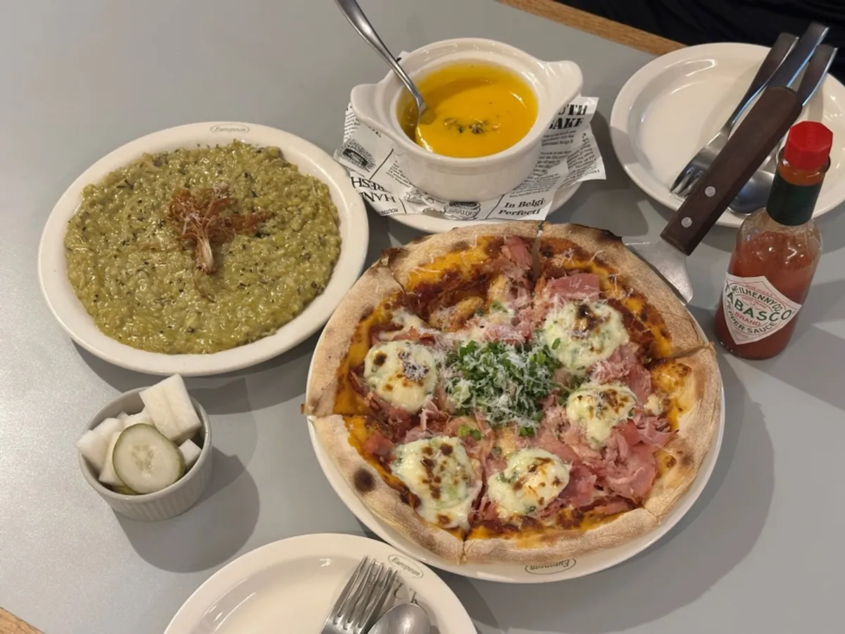 Pema-nong jambon pizza and abalone cream risotto on the table