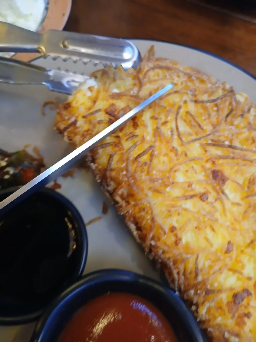 Cheese potato pancake folded into a half-moon shape