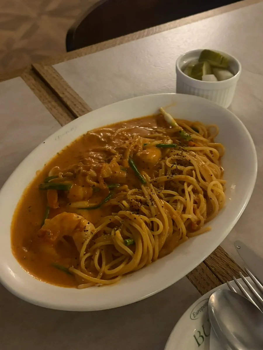 Close-up shot of the rosé sauce and noodles
